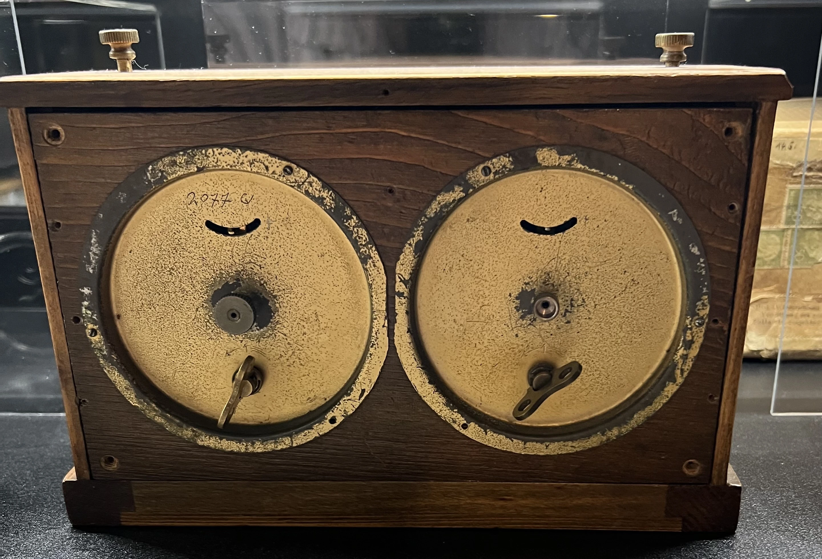 Rear view of an HAC chess clock showing two separate mechanical movements.
