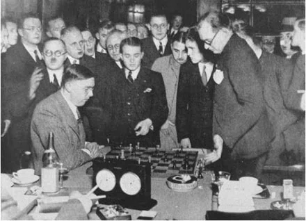 Max Euwe (seated) after game against Alexander Alekhine – 1935