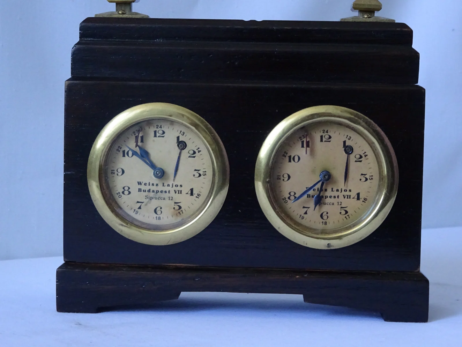 Weisz Lajos clock in a stepped dark case.