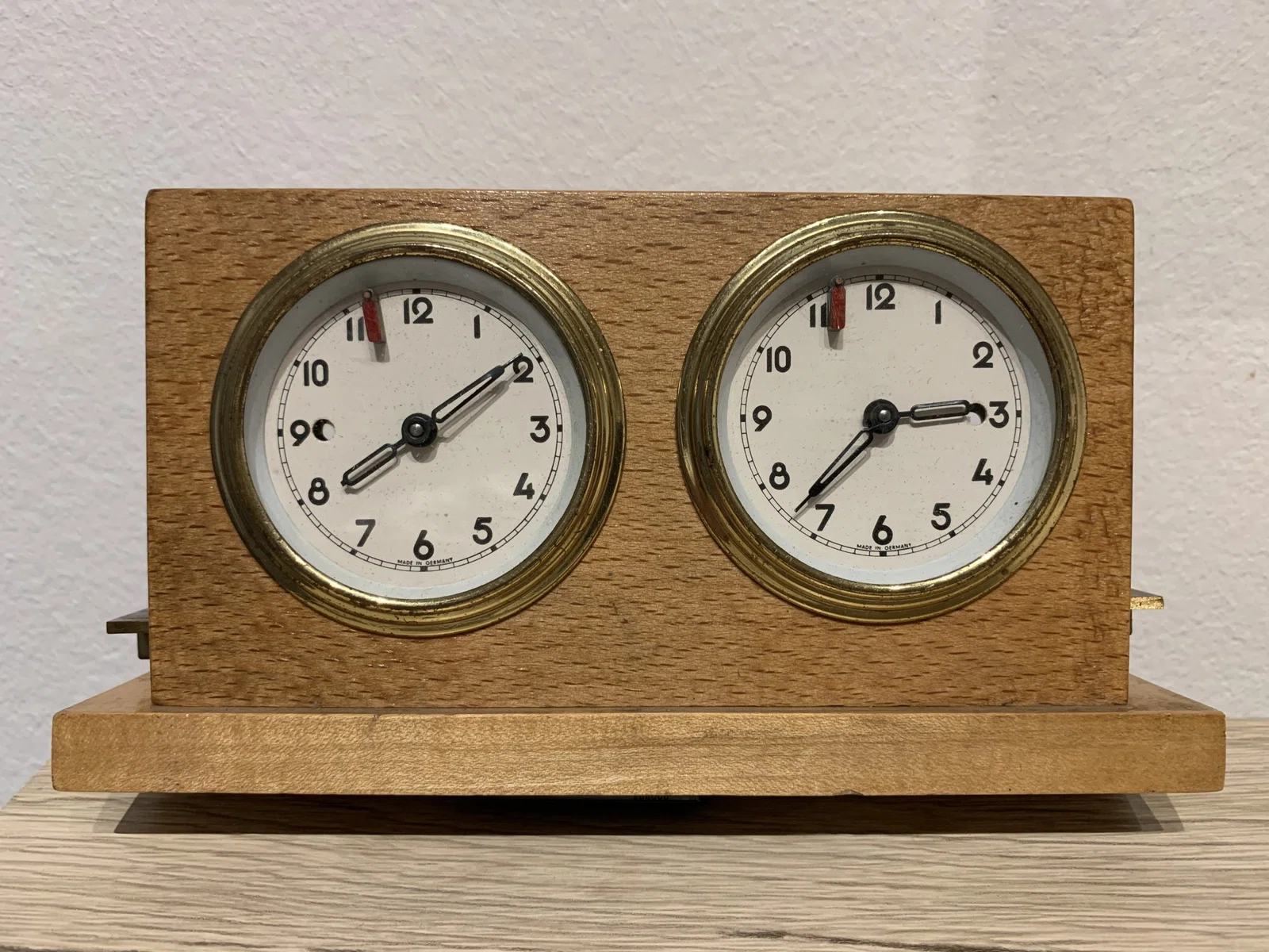Austrian wooden clock with a side pushbar.