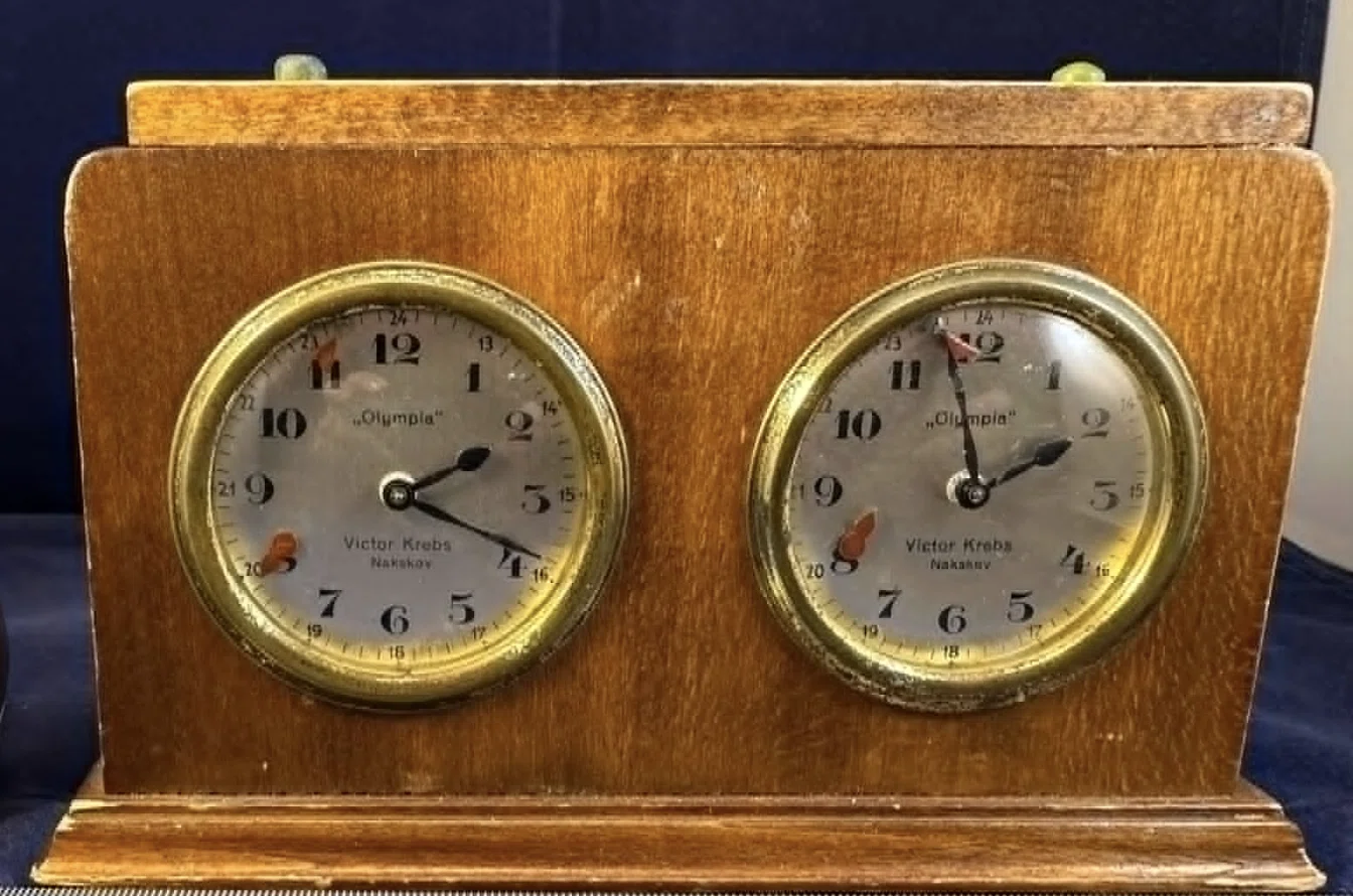 Victor Krebs Olympia clock in a wooden case.