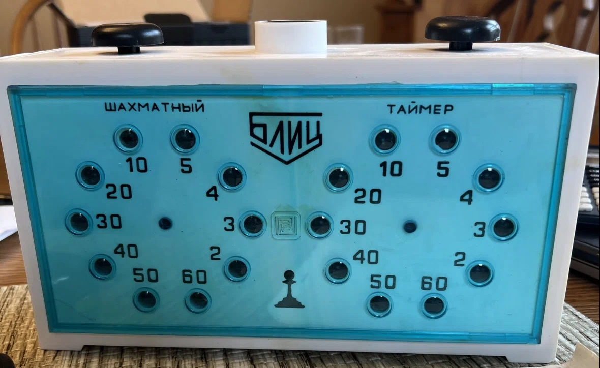 A Genuine Two-Player Chess Clock Using Discrete Illuminated Countdowns Rather than Numerical Digits.